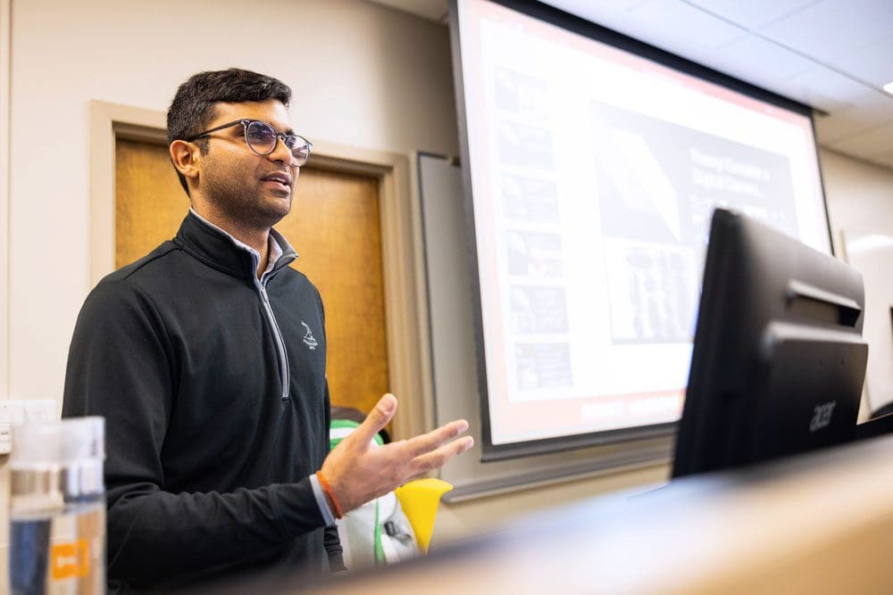 A doctoral student teaches a class.