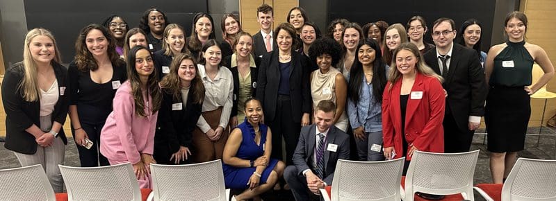 School of Journalism and Electronic Media student Abby Ann Ramsey (second row, center) with the other scholars meeting Senator Amy Klobuchar at a luncheon.