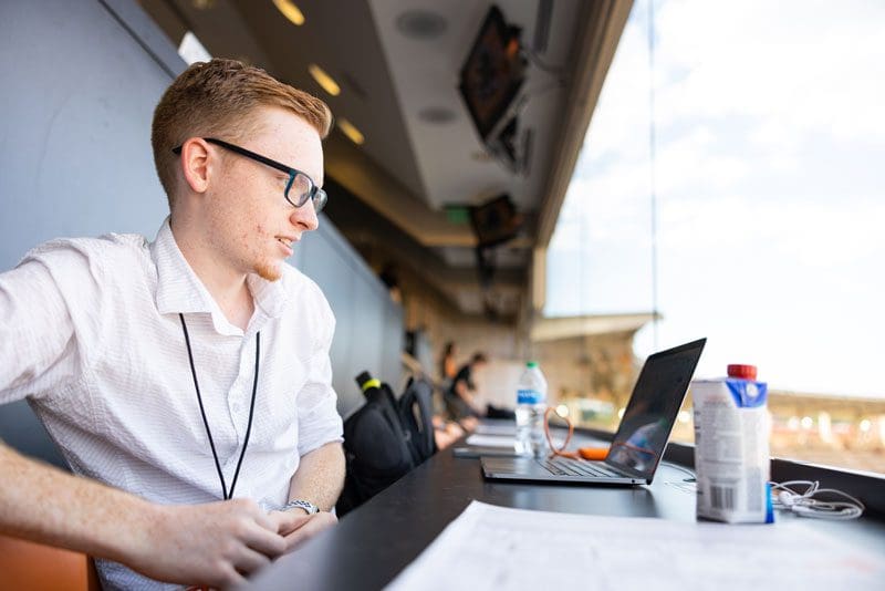Student Jack Foster covers a football game at Neyland Stadium.