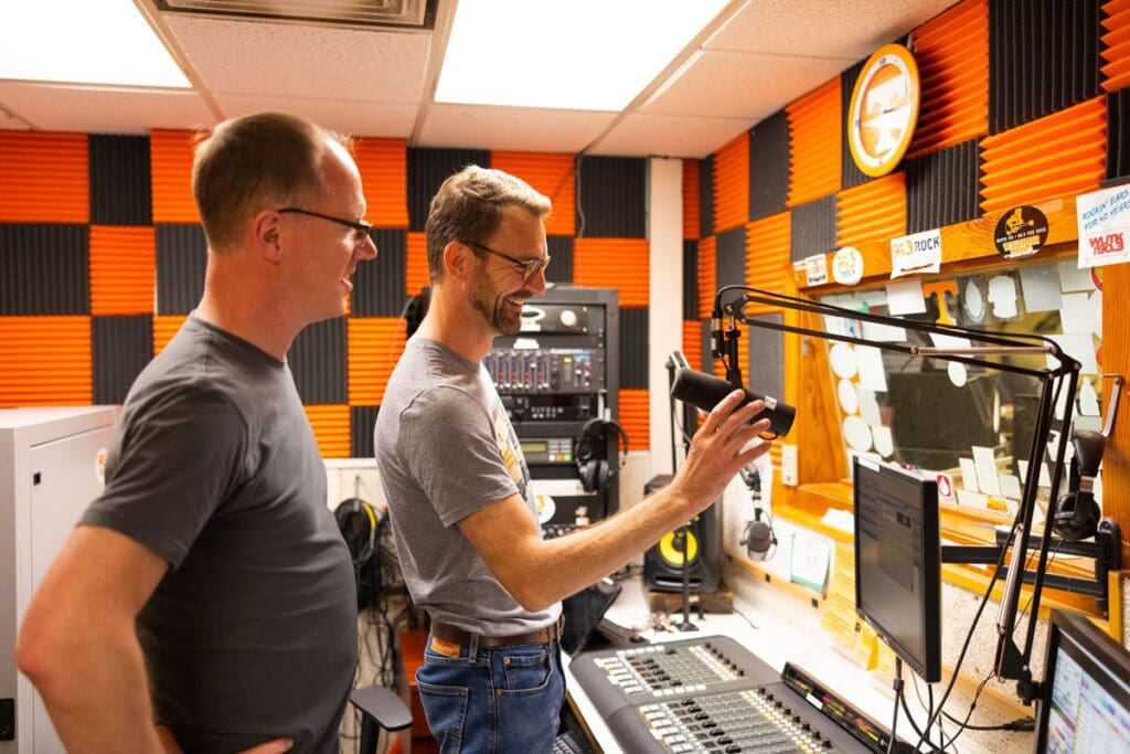 Alumnus Doug Alder and his partner Eric Middleton check out the WUTK studios.